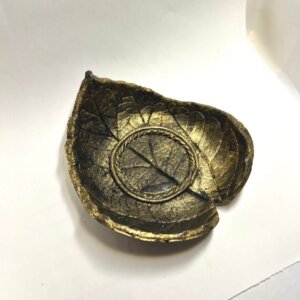 black golden diya holder
